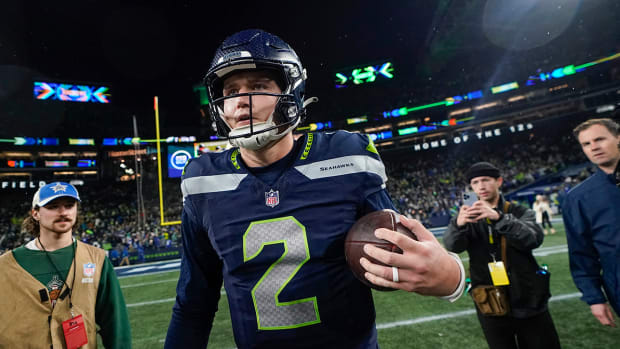 Seahawks quarterback Drew Lock walks on the field following a win against the Eagles.